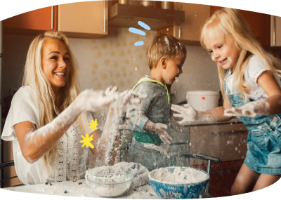 Babysitter and kids are making a mess of the kitchen as they play with flour and have fun